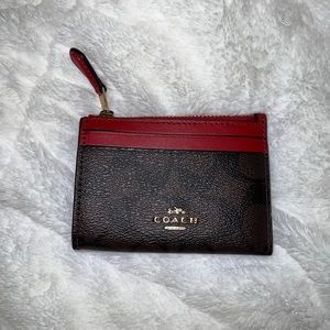 Coach key wallet. Brown and red. Great condition.